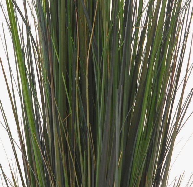 Nahaufnahme eines künstlichen Pflanzenstiels mit grünen Blättern.