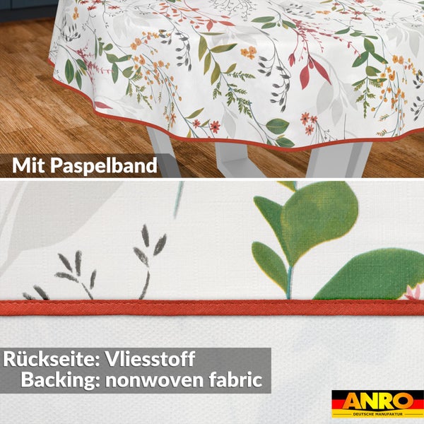 Rundes Wachstuch mit floralem Muster, Paspelband am Rand und Vliesrückseite. ANRO Logo.