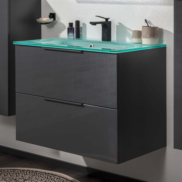 Waschtischunterschrank mit zwei Schubladen und Glaswaschtisch im Badezimmer.