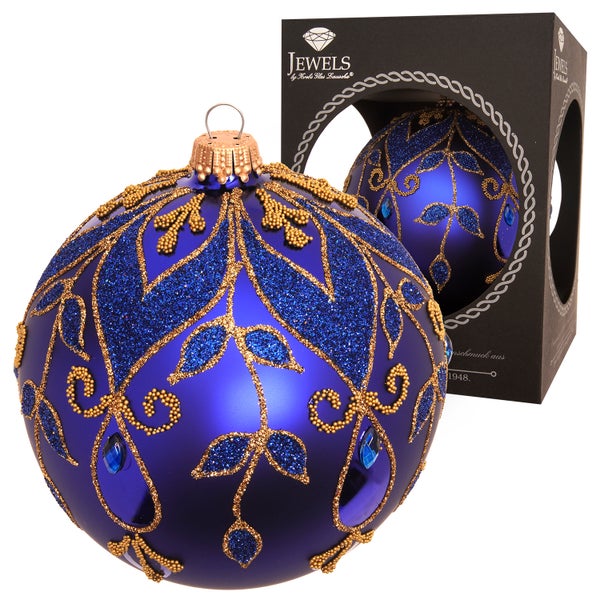 Dekorativer Weihnachtsbaumschmuck in Blau mit Goldverzierungen und Schmucksteinen in einer schwarzen Geschenkbox.