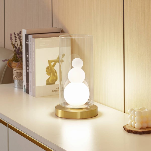 Dekorative Tischleuchte mit klarem Glaszylinder und goldenem Sockel