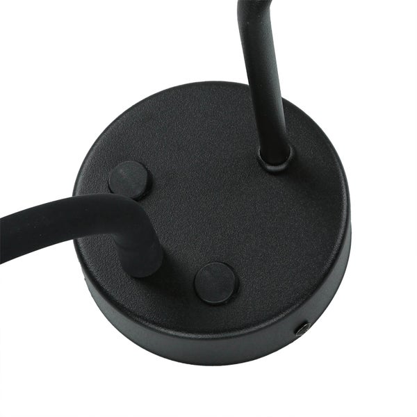 Detailansicht einer schwarzen Wandleuchtenhalterung mit Befestigungselementen