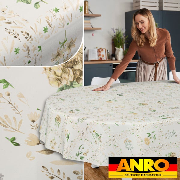 Runde Tischdecke mit floralem Muster aus Wildblumen und Blättern in einer hellen Küche mit Detailansicht und ANRO Deutsche Manufaktur Logo.