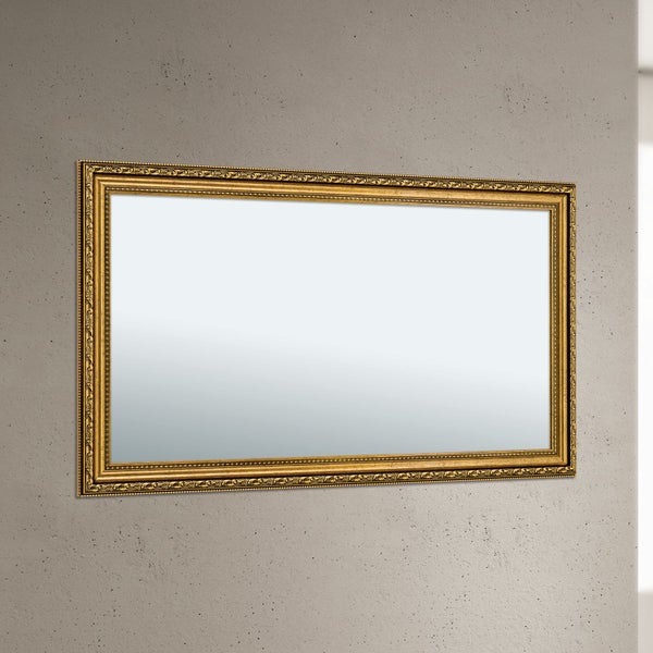 Wandspiegel mit rechteckigem Rahmen im klassischen Stil an einer Betonwand