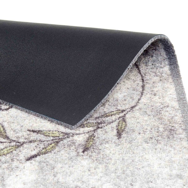 Detailansicht einer Fußmatte mit floralem Muster und rutschfester Rückseite