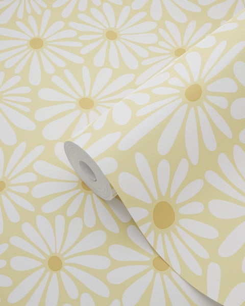 Vliestapete auf Rolle mit großem Gänseblümchen-Muster in Weiß und Gelb.