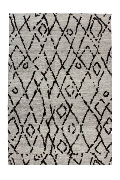 Rechteckiger Teppich mit geometrischem Rautenmuster aus unregelmäßigen Linien.