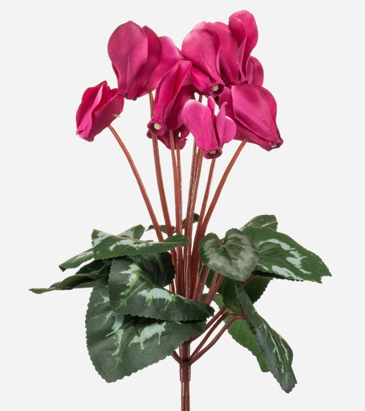 Nahaufnahme von pinkfarbenen künstlichen Alpenveilchen aus Textil.