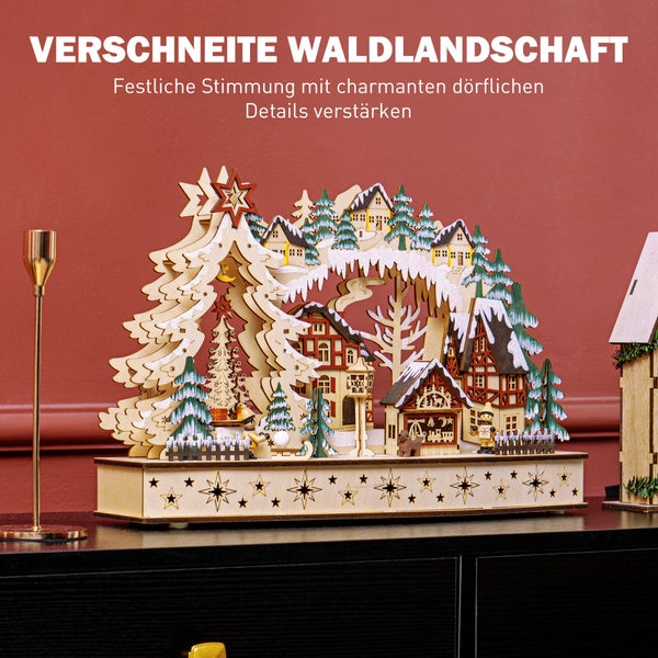 Weihnachtlicher Schwibbogen aus Holz mit verschneiter Waldlandschaft, Fachwerkhäusern und Tannenbäumen.