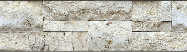 Wandverblender mit strukturierter Natursteinoptik in rechteckiger Anordnung.
