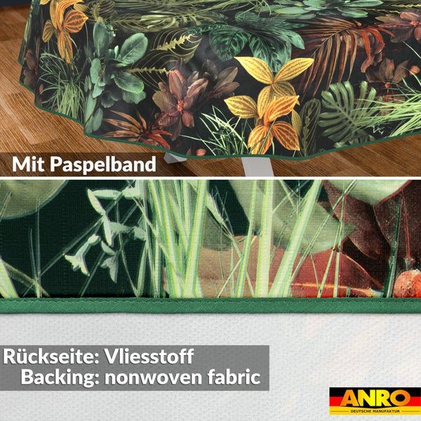 Tischdecke mit tropischem Blättermuster, Paspelband und Vliesstoff-Rückseite. Anro Logo.