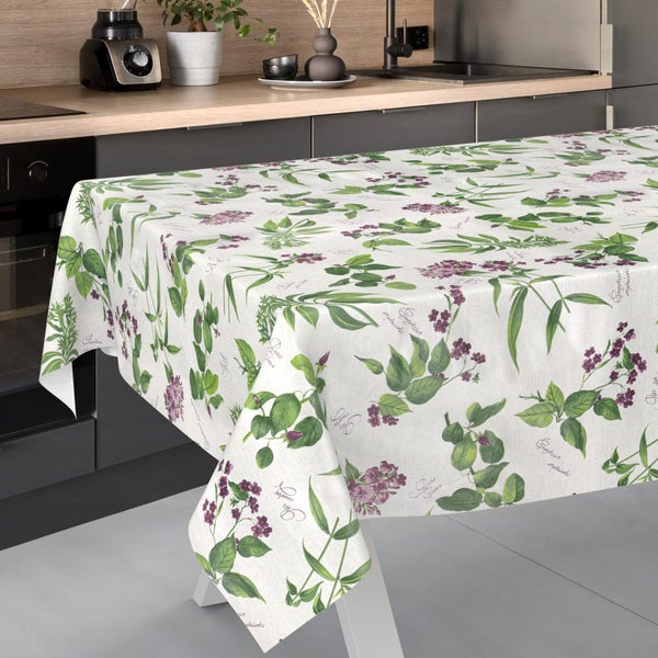 Rechteckige Tischdecke mit botanischem Muster aus lilafarbenen Blüten und grünen Blättern in einer modernen Küche.