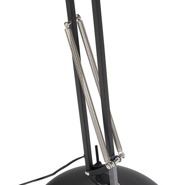 Detail einer schwarzen Stehlampe mit Federmechanismus