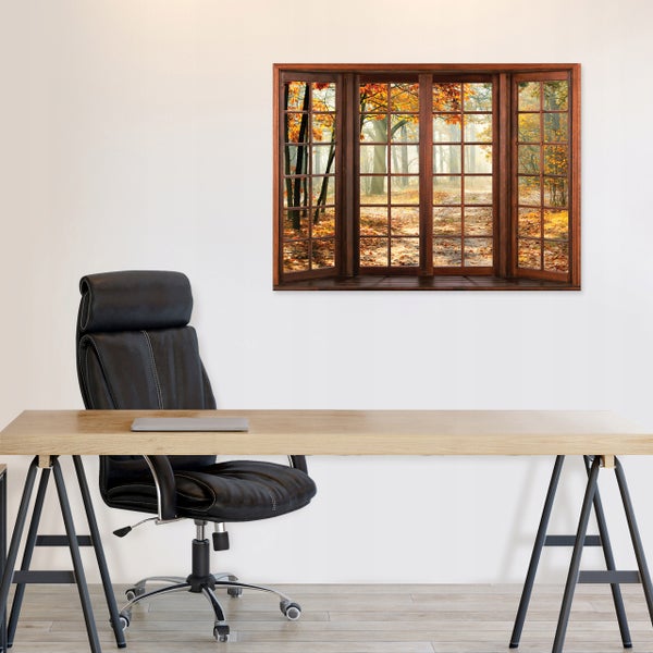 3D Wandbild mit Fensterausblick auf einen herbstlichen Wald über einem Holzschreibtisch und schwarzen Bürostuhl in einem hellen Raum.