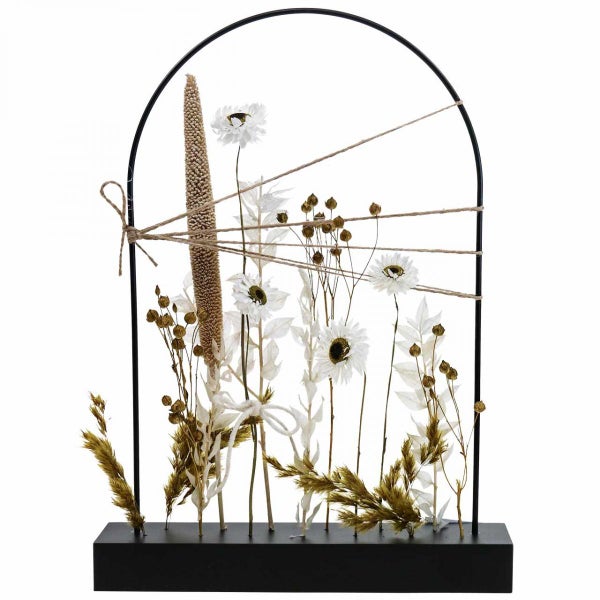 Dekorative Trockenblumenanordnung in schwarzem Rahmen auf Sockel