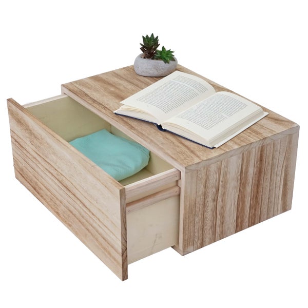 Nachttisch aus Holz mit offener Schublade, Buch und Pflanze