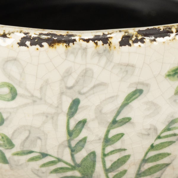 Detailansicht eines Keramik-Pflanztopfes mit Craquelé-Glasur und Blattmuster.