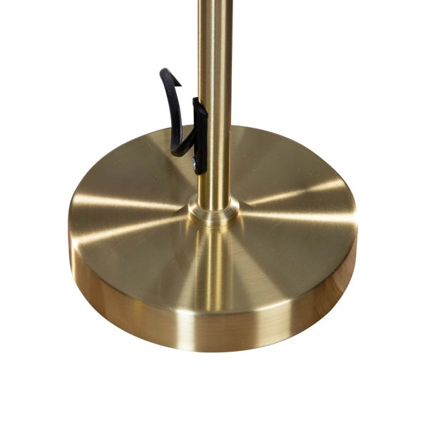 Detailaufnahme eines Lampenfußes aus Metall mit einer Kabelklemme