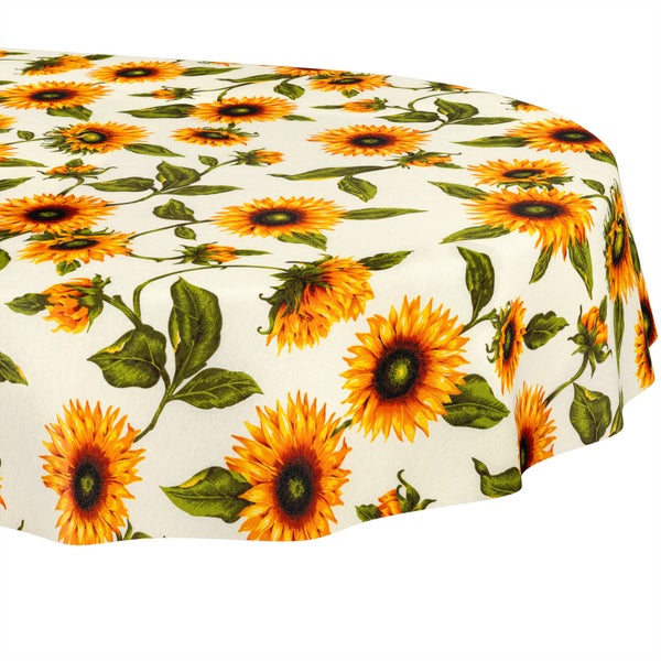Tischdecke mit Sonnenblumen-Motiv und grünen Blättern.