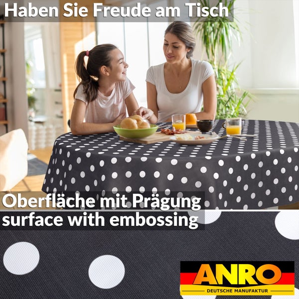 Runde Tischdecke mit weißen Punkten, geprägte Oberfläche, Frühstücksszene mit Mutter und Kind, ANRO Logo.