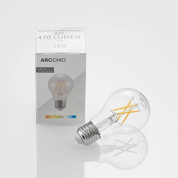 Arcchio LED Leuchtmittel E27, 4 Watt, 470 Lumen, warmweiß 2700 Kelvin, Birnenform aus Klarglas mit sichtbaren Filamenten und Verpackung.
