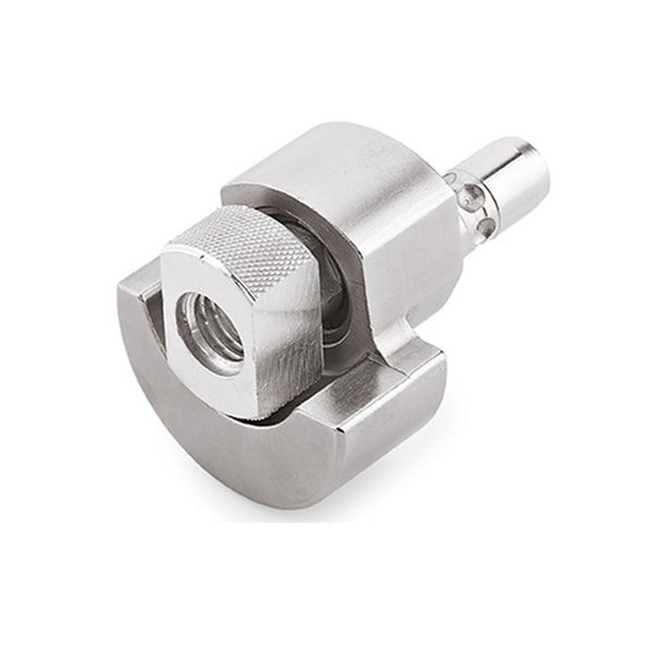 Ein metallischer Verbindungsbeschlag für Möbelbauteile mit einer gerändelten Mutter.