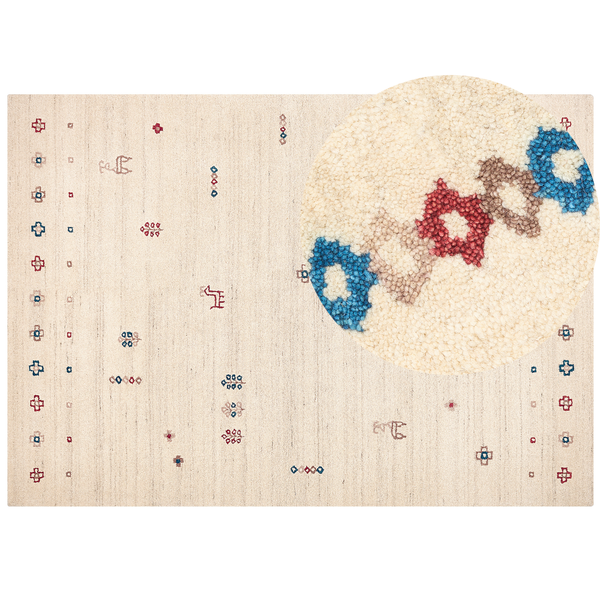Handgeknüpfter Wollteppich mit bunten ethnischen Motiven und Detailaufnahme der Florstruktur.