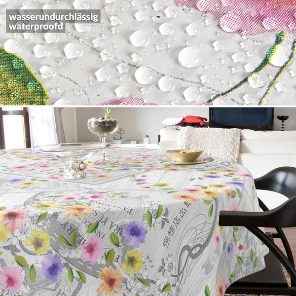 Runde, wasserundurchlässige Tischdecke mit Blumenmuster und Vintage-Print auf einem Esstisch.