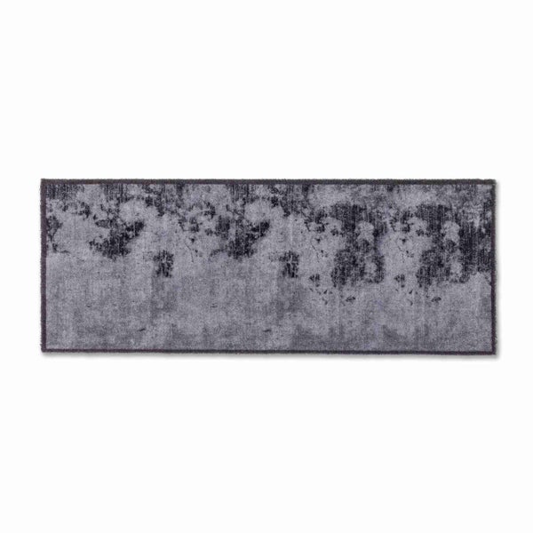 Grauer Teppich mit abstraktem Muster