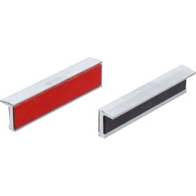 Zwei Möbelgriffe in Profilform mit Einlagen aus Metall