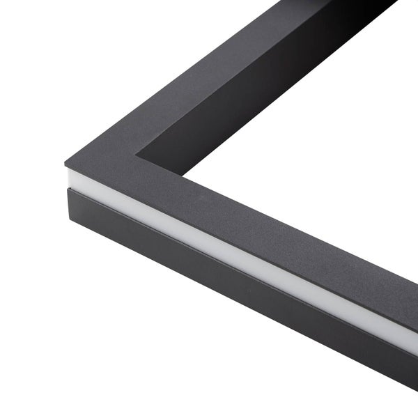 Nahaufnahme einer Ecke eines schwarzen LED-Rahmens mit integriertem weißen Lichtstreifen.