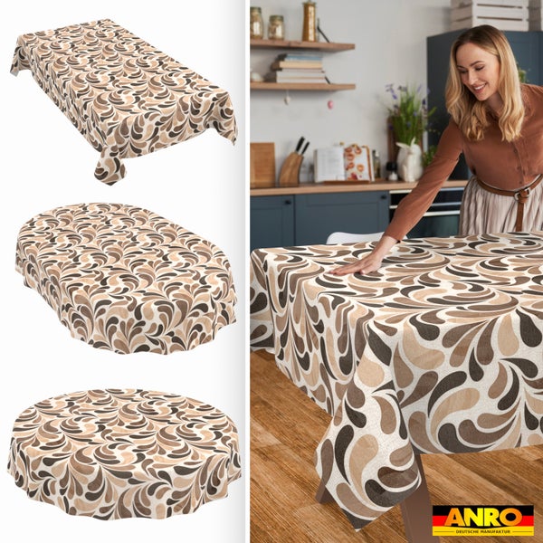 Tischdecke mit braunem Tropfenmuster, rechteckig, oval und rund. Frau glättet die Decke auf einem Holztisch in einer hellen Küche. ANRO Logo.
