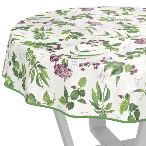 Runde Tischdecke mit botanischem Print aus grünen Blättern und violetten Blüten sowie grünem Rand.