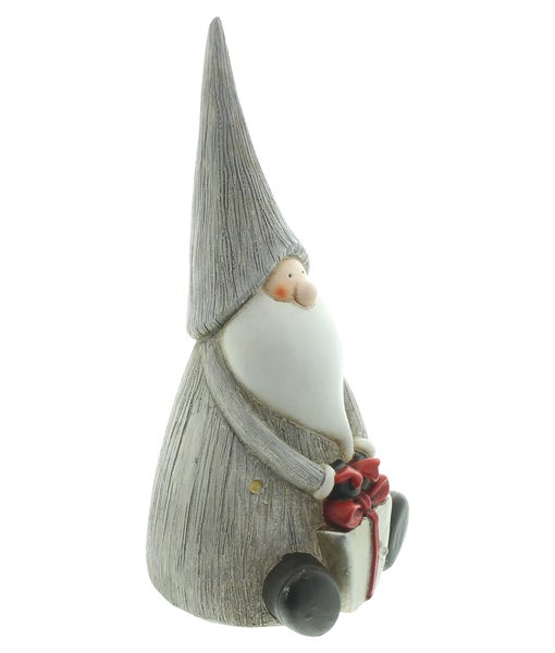 Dekorativer Weihnachtswichtel mit Geschenk
