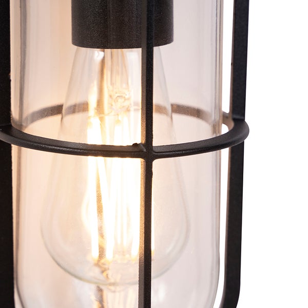 Detailansicht einer Außenleuchte mit schwarzem Metallkäfig, klarem Glas und leuchtendem LED-Filament-Leuchtmittel.