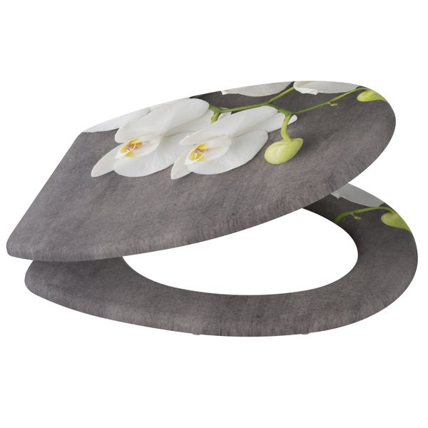 Toilettensitz mit Orchideen Motiv auf Steinoberfläche
