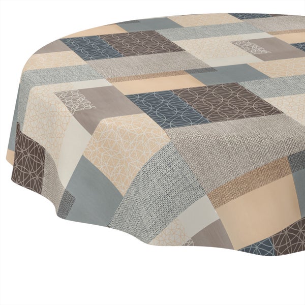 Runde Tischdecke mit geometrischem Patchwork-Muster in verschiedenen Texturen und Designs.