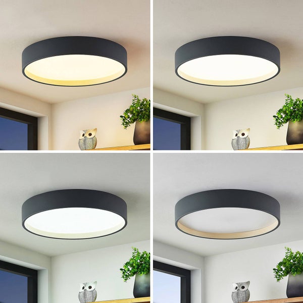 Runde LED Deckenleuchte mit schwarzem Rahmen und Holz-Innenring, zeigt vier Lichtfarben von Warmweiß bis Tageslichtweiß.