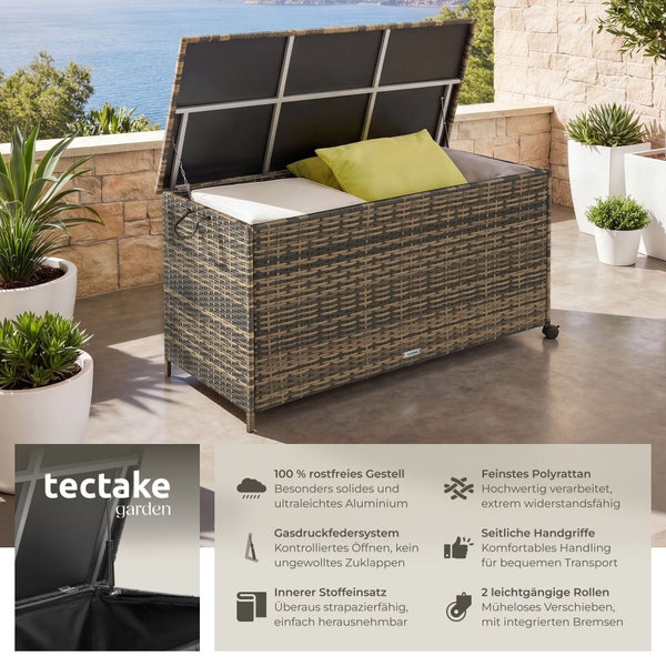 Große Auflagenbox aus Polyrattan auf einer Terrasse mit offenem Deckel, Gasdruckfeder, Innenfutter, Rollen, Griffen und tectake garden Logo.