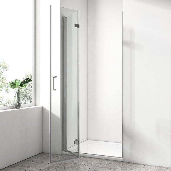 Moderne, rahmenlose Duschkabine aus Glas mit Metallbeschlägen in einem hellen, minimalistischen Badezimmer.