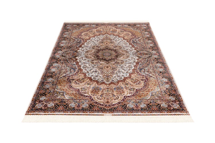 Orientteppich mit Medaillon-Muster und Fransen.