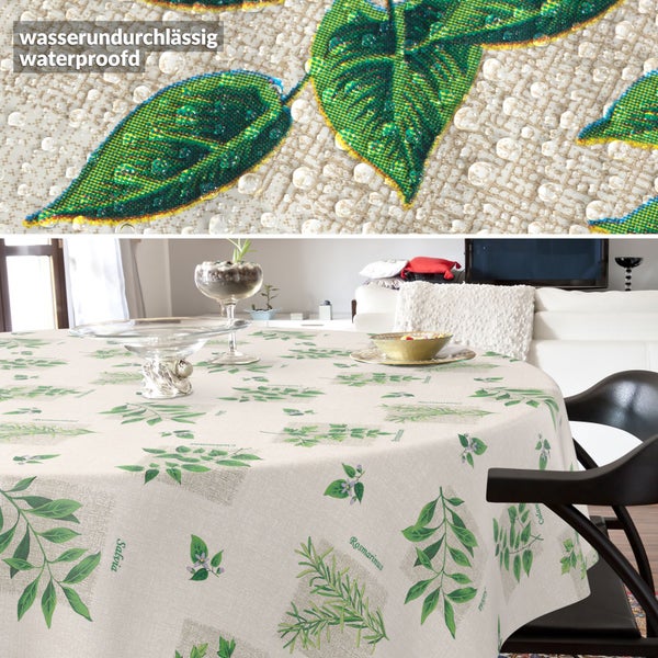Runde, wasserundurchlässige Tischdecke mit Kräutermotiven wie Salbei und Rosmarin, Detailansicht der wasserdichten Gewebestruktur.