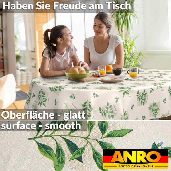 Rundes Tischtuch mit Kräutermotiv und glatter Oberfläche in einer hellen Esszimmerszene mit zwei Personen, ANRO Logo.