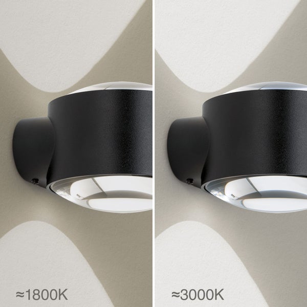 Schwarze Außenwandleuchte mit Lichtkegeln oben und unten, Vergleich der Farbtemperaturen circa 1800 Kelvin und circa 3000 Kelvin.