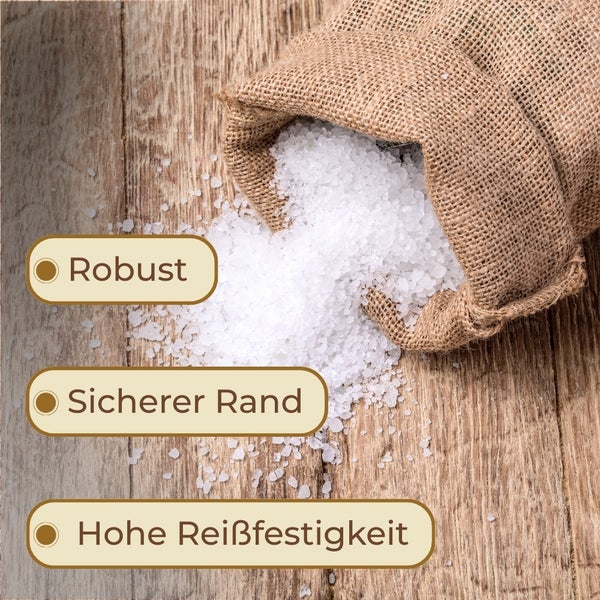 Jutesack mit grobem Salz, das auf einem Holztisch verschüttet wurde, mit den Hinweisen robust, sicherer Rand und hohe Reißfestigkeit