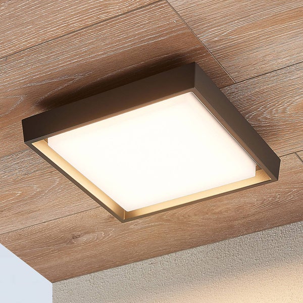 Quadratische LED Deckenleuchte mit dunklem Metallrahmen an einer Holzdecke montiert, helles und modernes Design.