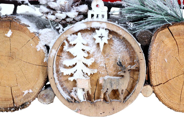 Dekoration mit Holzscheiben, Tanne, Stern und Hirsch