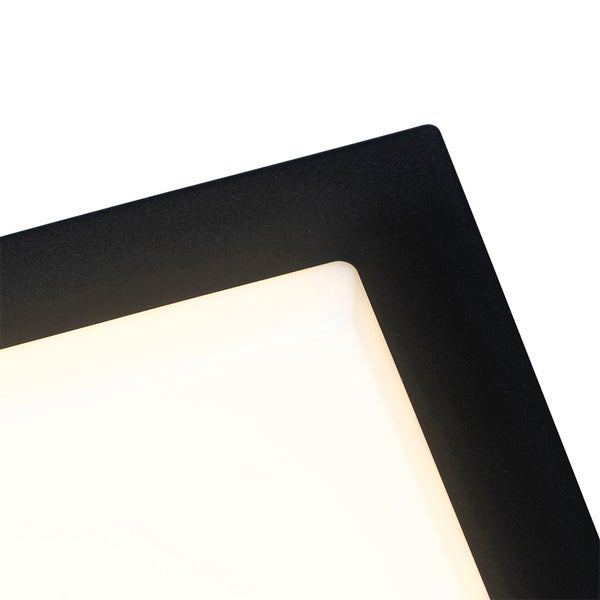 Detailansicht einer eckigen LED-Paneelleuchte mit schwarzem Rahmen und weißer Leuchtfläche.