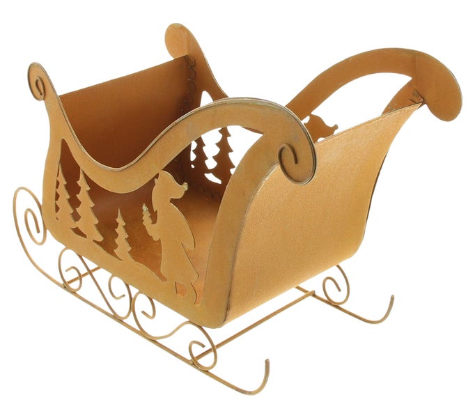 Dekorative Schlittenfigur mit ausgeschnittenen Waldmotiven