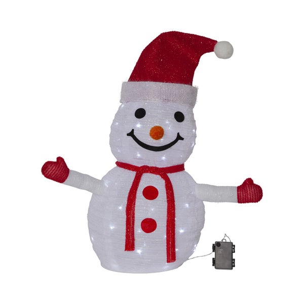 Beleuchteter Schneemann mit rotem Hut und Schal als Weihnachtsdekoration